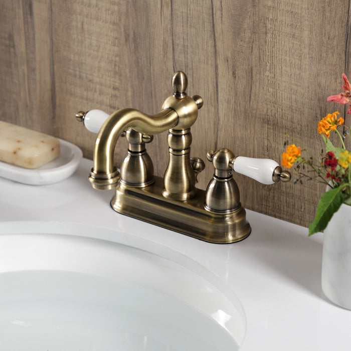 Heritage KB1603PL Double-Handle 3-Hole Deck Mount 4-Inch Centerset Bathroom Faucet with Pop-Up Drain, Antique Brass